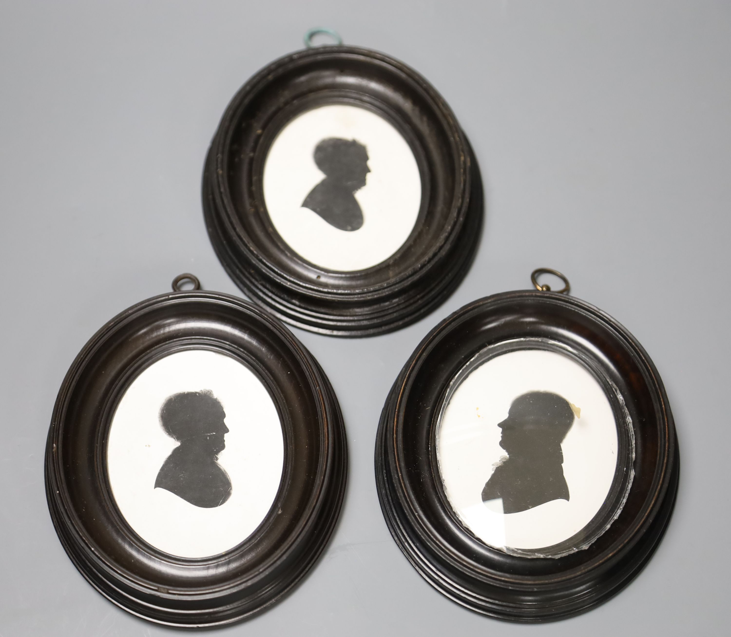 Three silhouettes on plaster by John Miers (1756-1821), one with London trade label, original pearwood frames